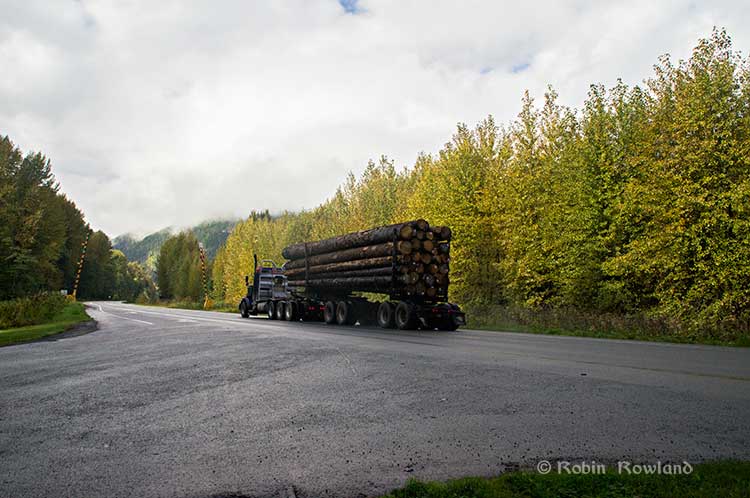 A logging truck passes the avalanche gates at Exstew on Highway 16, Sept. 29, 2014.  (Robin Rowland)